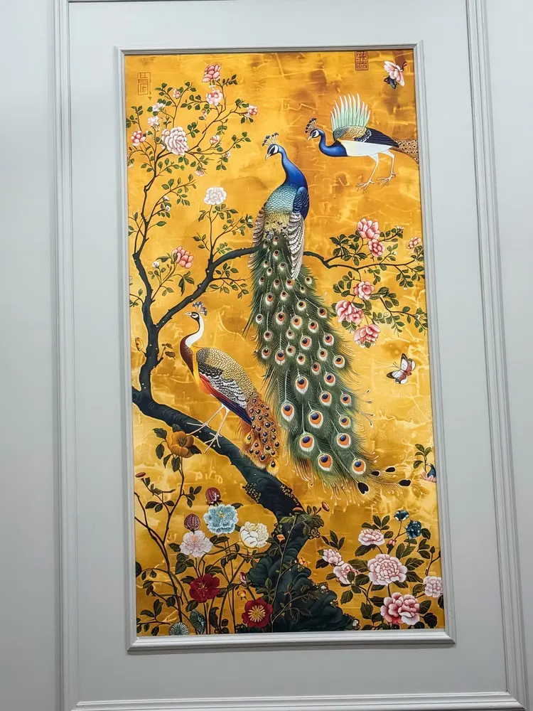 Golden peacock art panel in the corridor