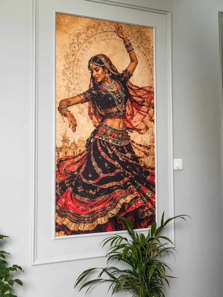 Painting of a Rajasthani dancer in a white frame