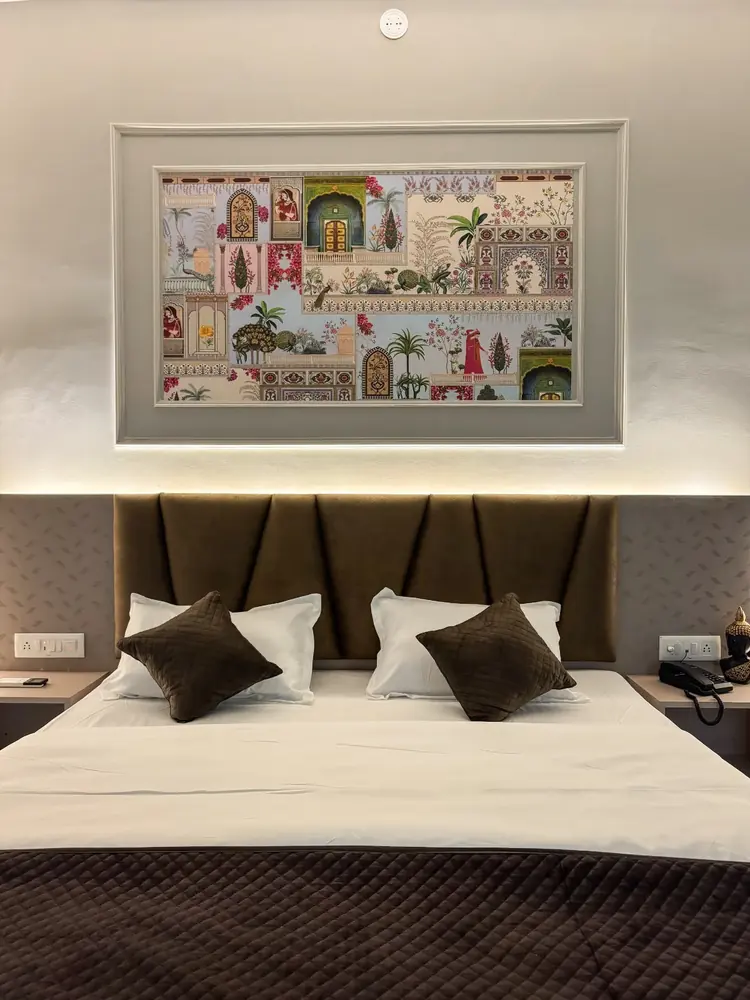 Queen bed with backlit Rajasthani mural